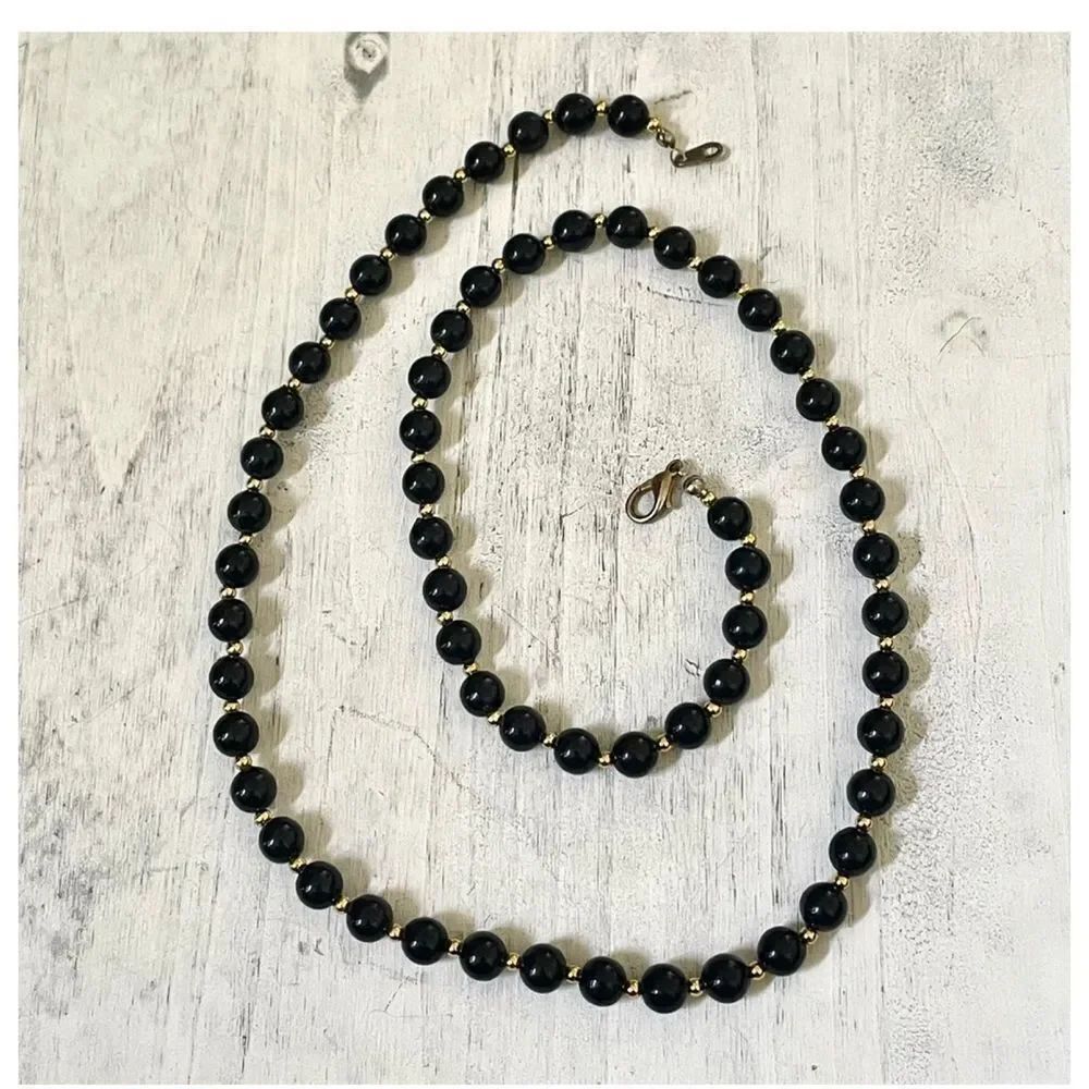 Black and gold tone beaded necklace